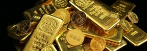Goldbarren und Münzen