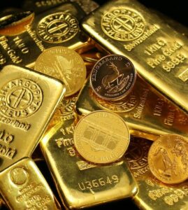 Goldbarren und Münzen